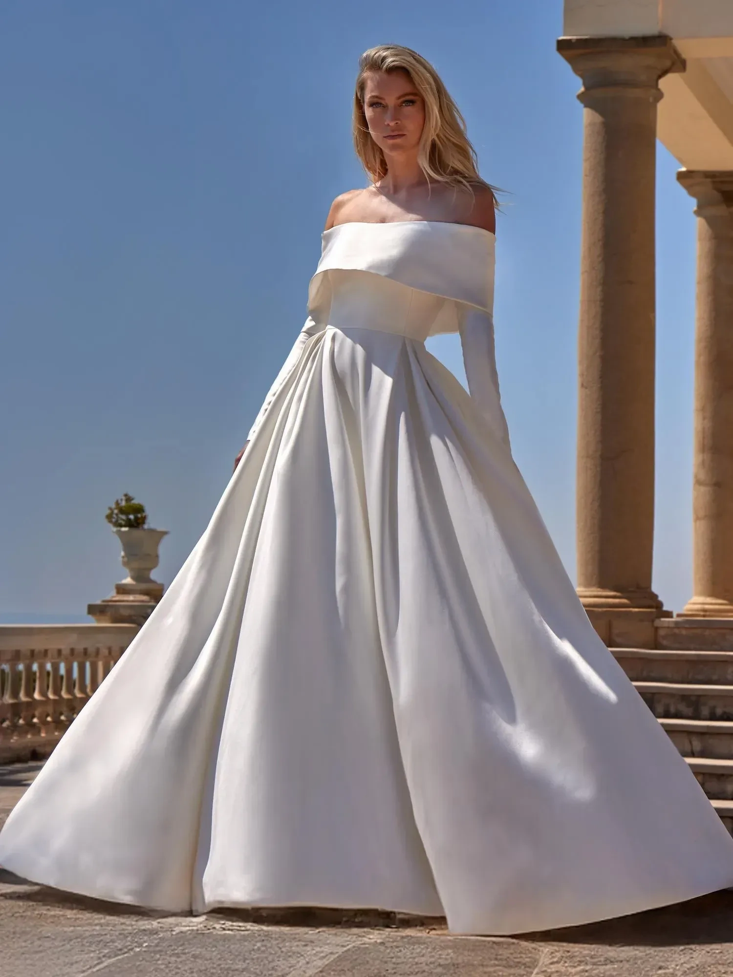 Model wearing a white gown by Pronovias