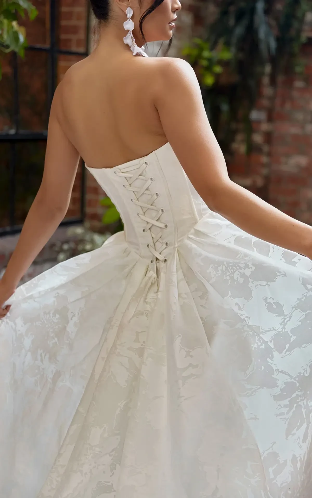 Corset back wedding dress in a basque waist