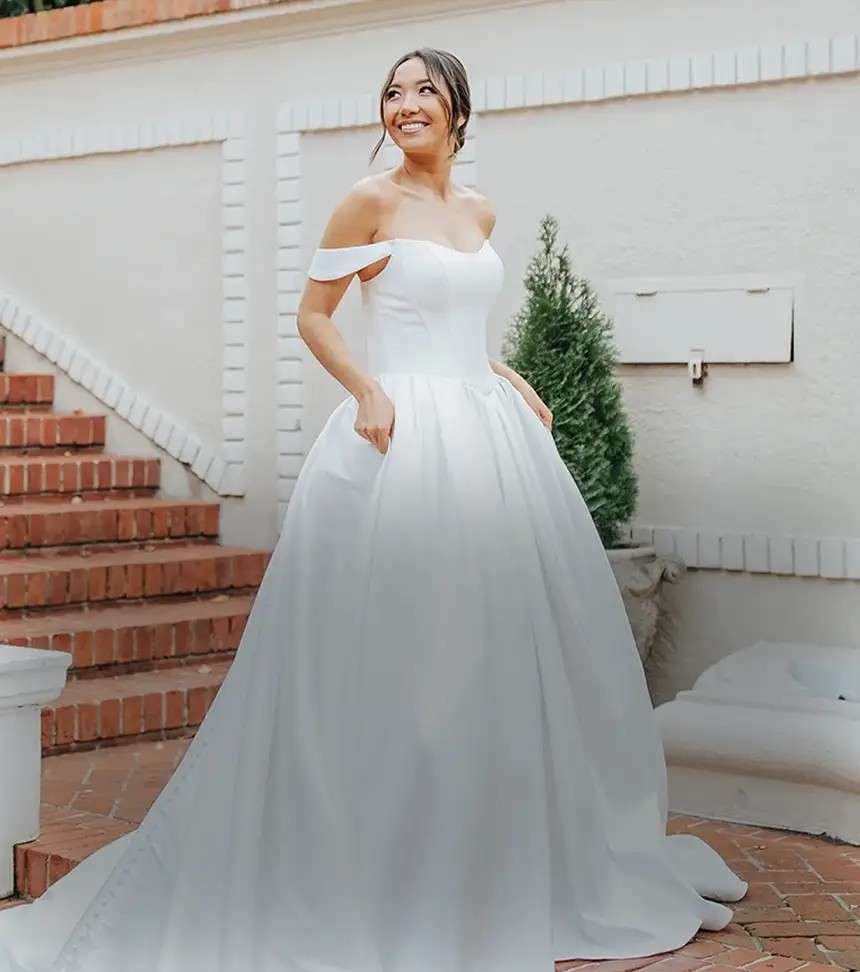 Model wearing a bridal dress. Mobile image