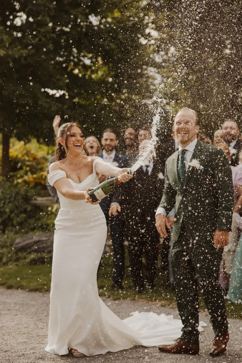 Сouple wearing a white gown and a black suit
